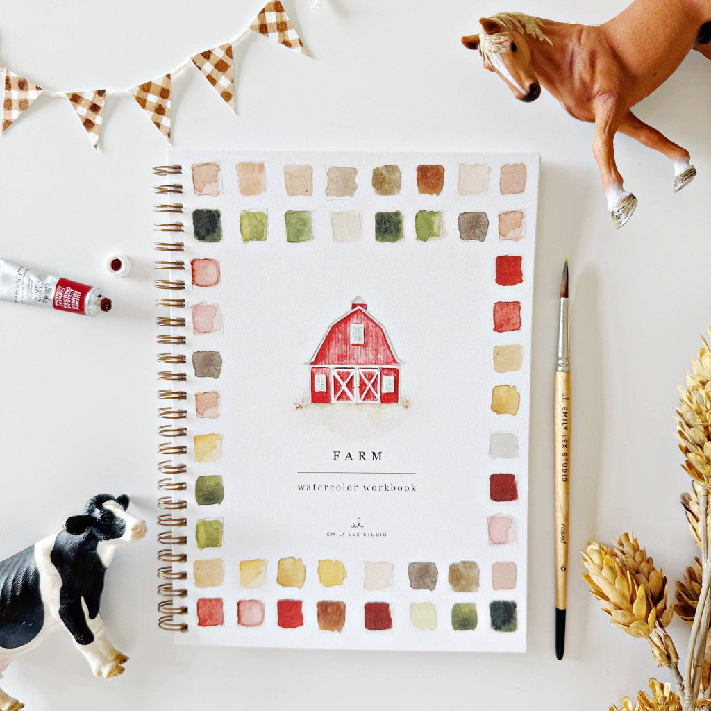 Farm-themed watercolor workbook with a red barn illustration, surrounded by model animals and decor on a white surface.
