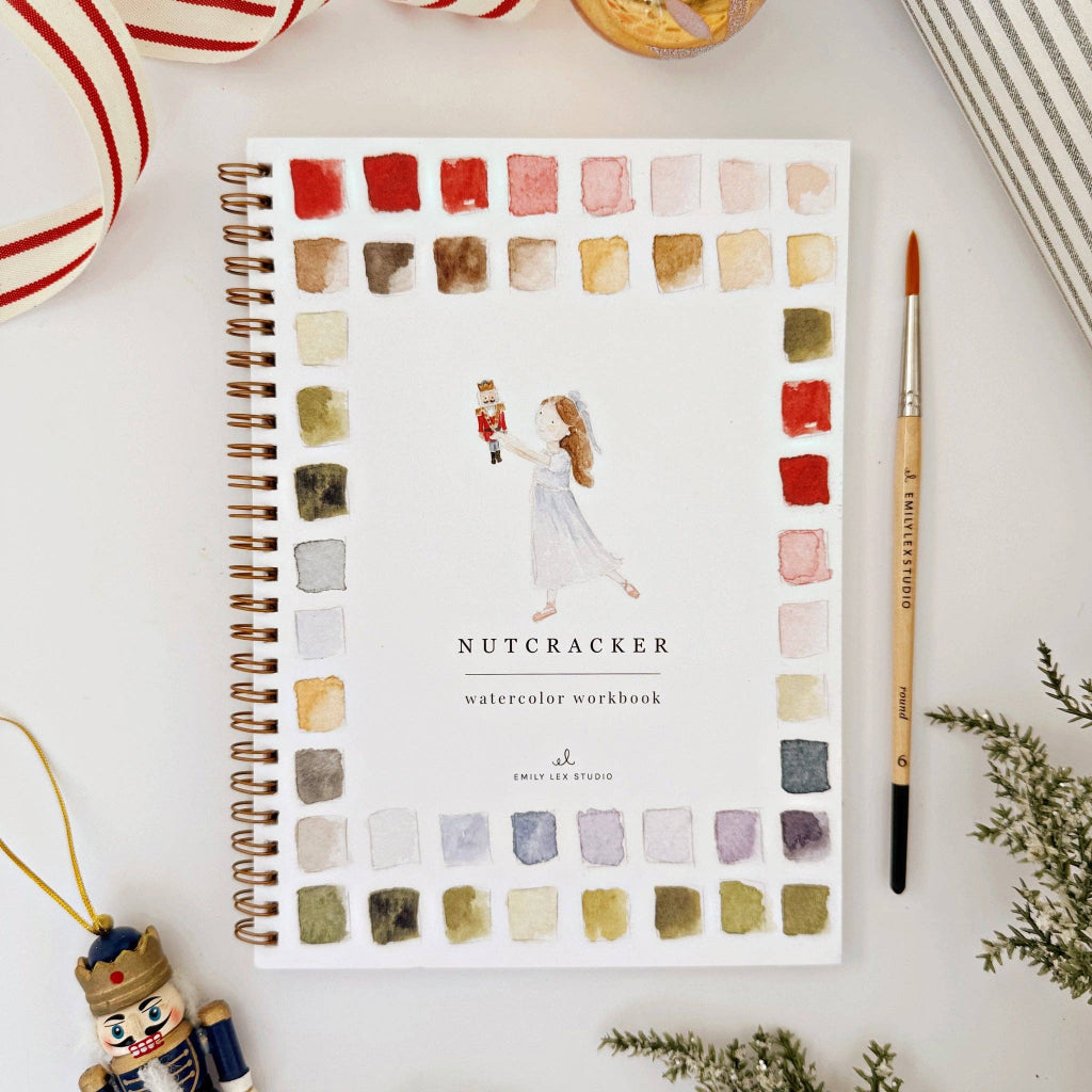 Emily Lex Studio Nutcracker Watercolor workbook front cover with color swatches on a white surface, available at Lighthouse Paper Co. in Melbourne, FL