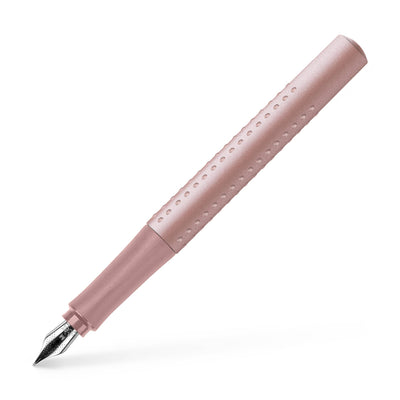 Pink fountain pen on a white background