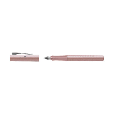 Pink pen with cap on a white background