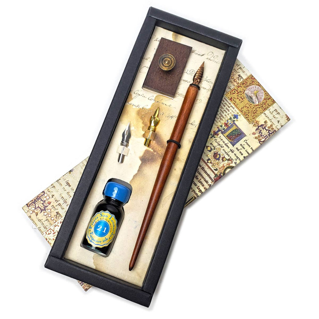 Pen set with ink bottle and decorative elements on a white background