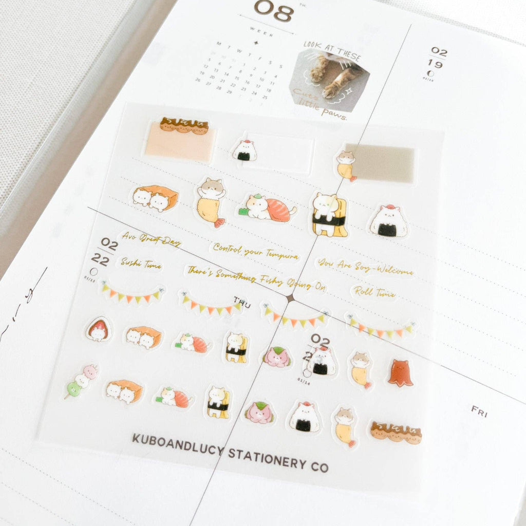 Calendar sheet with cute illustrations and text, featuring the brand 'KUBOANDLUCY'.