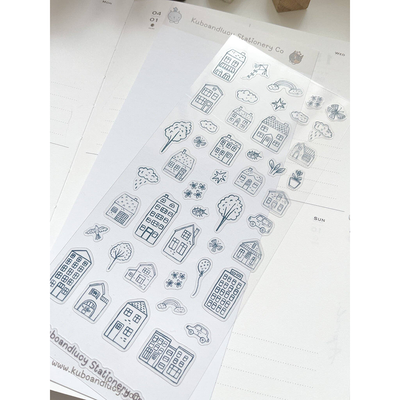 Sheet of black line art stickers featuring houses and nature elements on a white background.