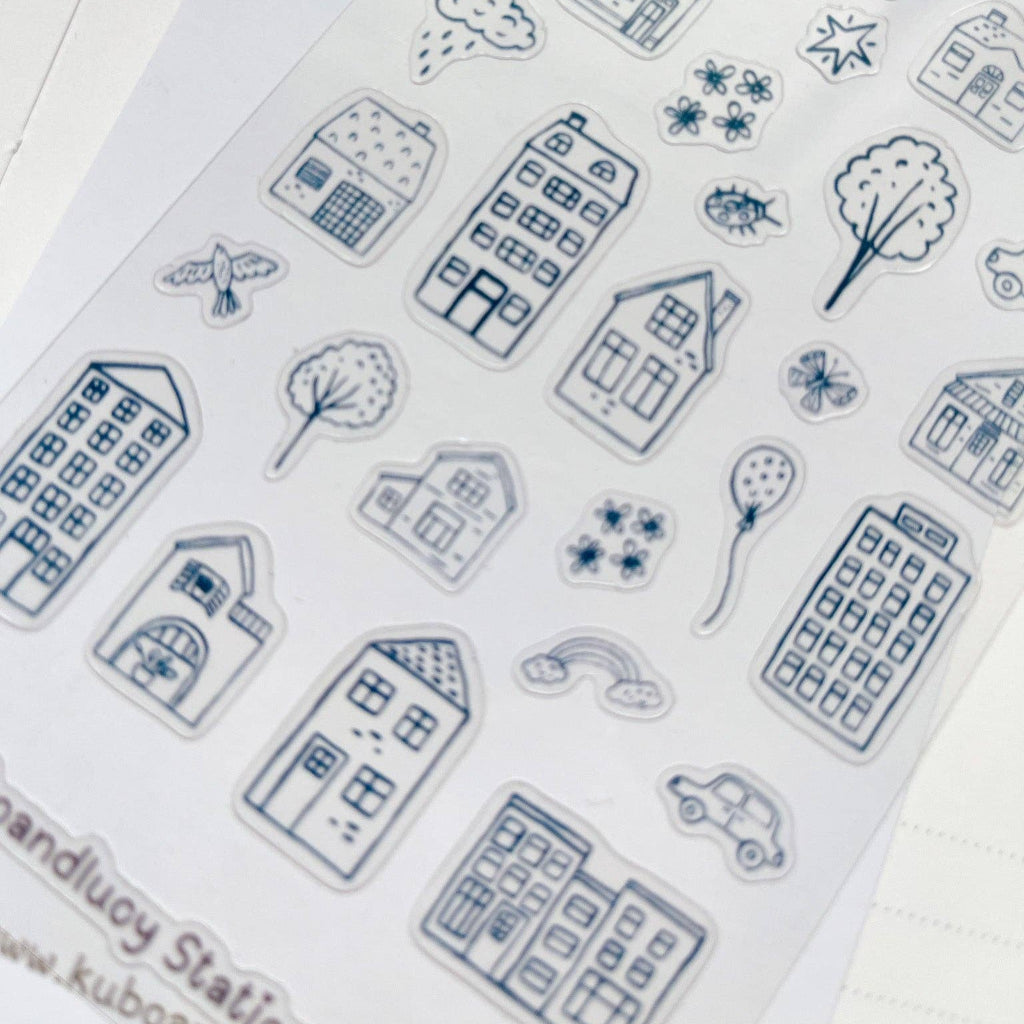 Collection of blue house and nature-themed stamps on a white background