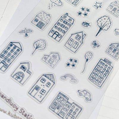 Collection of blue house and nature-themed stamps on a white background