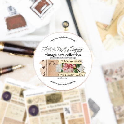 Round label with text and design elements on a blurred background of stationery items