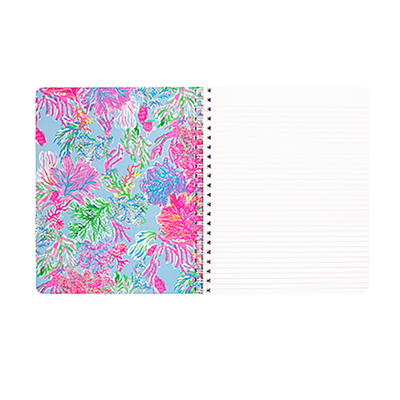 Notebook with colorful floral design on the cover and white lined pages.