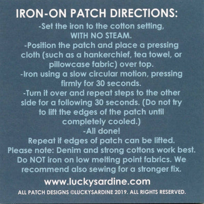 Instructions for ironing on a patch with Lucky Sardine branding.