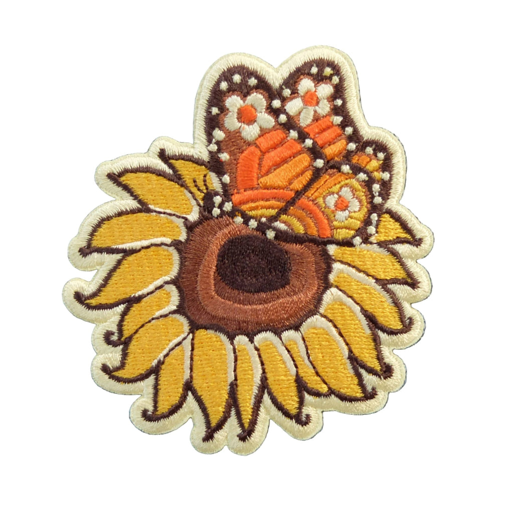 Embroidered patch with a sunflower and butterfly design on a white background