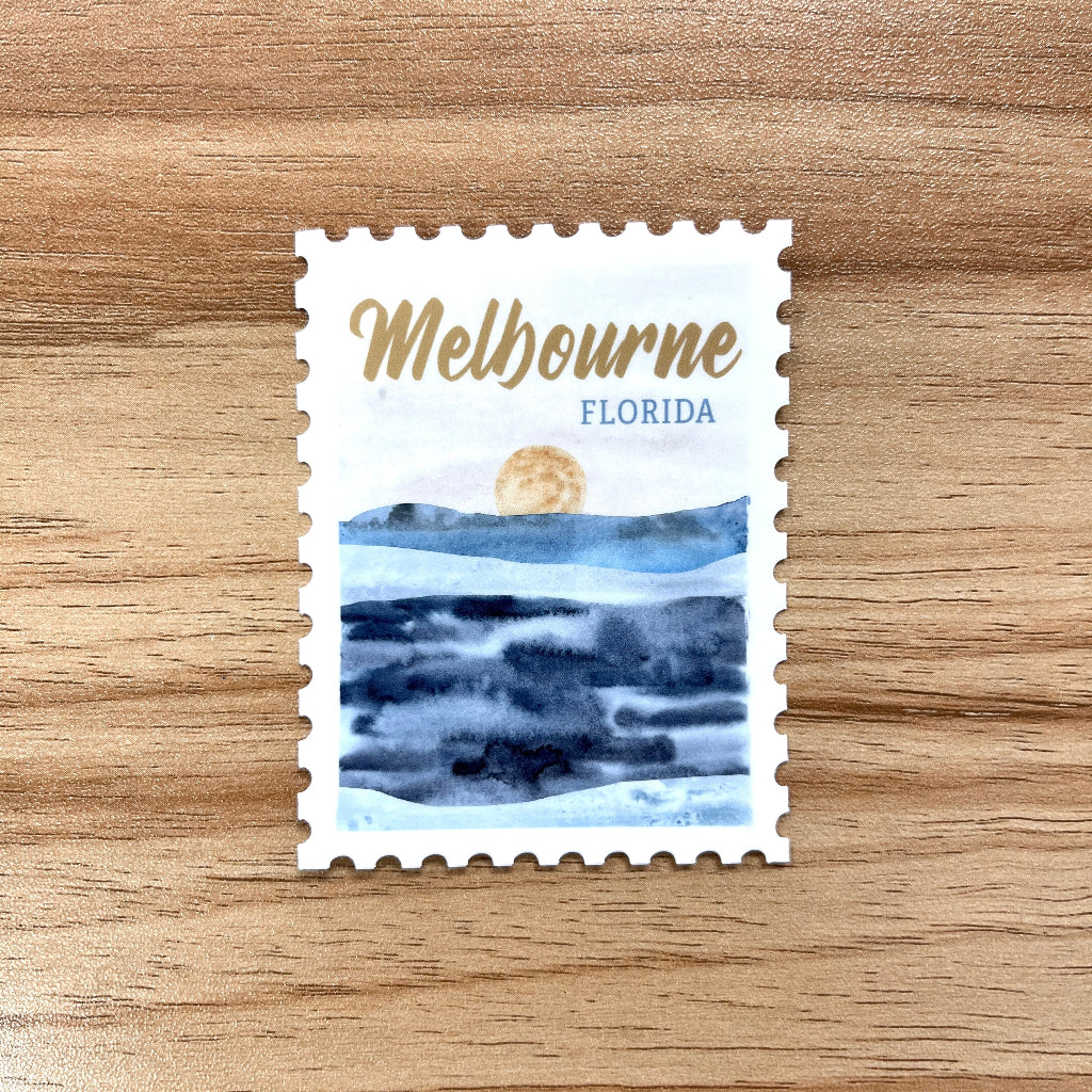 Stylized postage stamp with 'Melbourne, Florida' text on a wooden surface