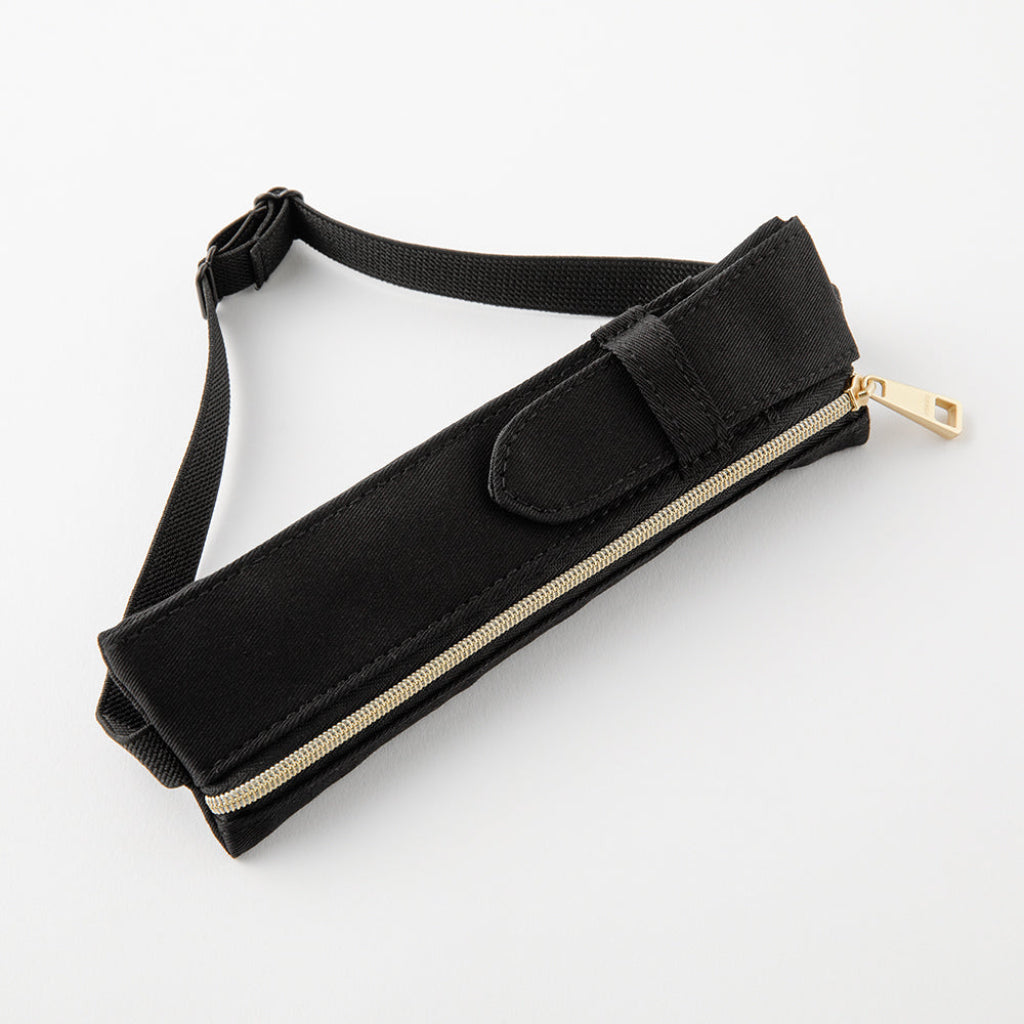 Black belt with a gold zipper on a white background