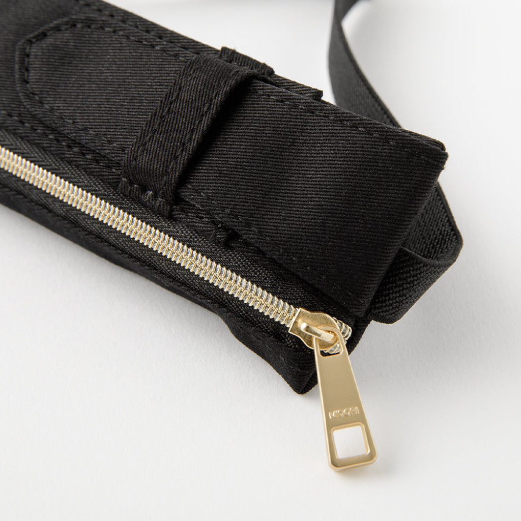 Black belt with a gold zipper on a white background