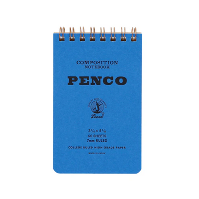 Blue composition notebook with 'Penco' branding on a white background