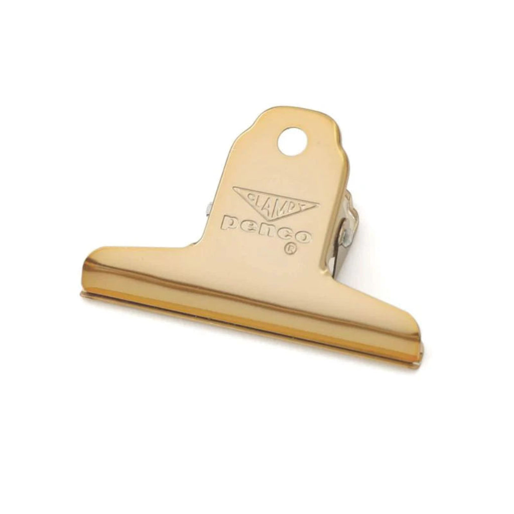 Gold-colored clip with Perco branding on a white background