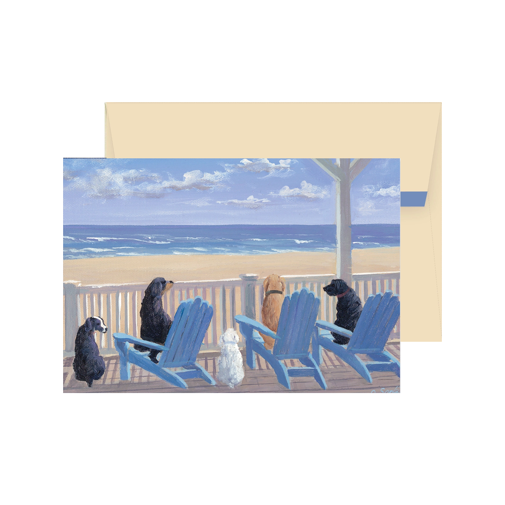 Card with a painting of four dogs on blue Adirondack chairs on a deck overlooking the ocean.