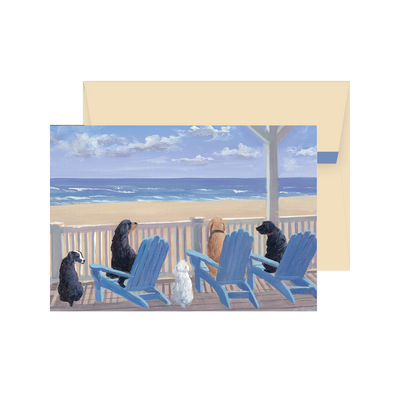 Card with a painting of four dogs on blue Adirondack chairs on a deck overlooking the ocean.