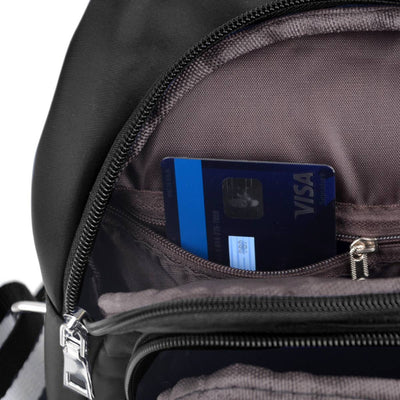 Close-up of a black backpack with a blue Visa card inside a pocket.
