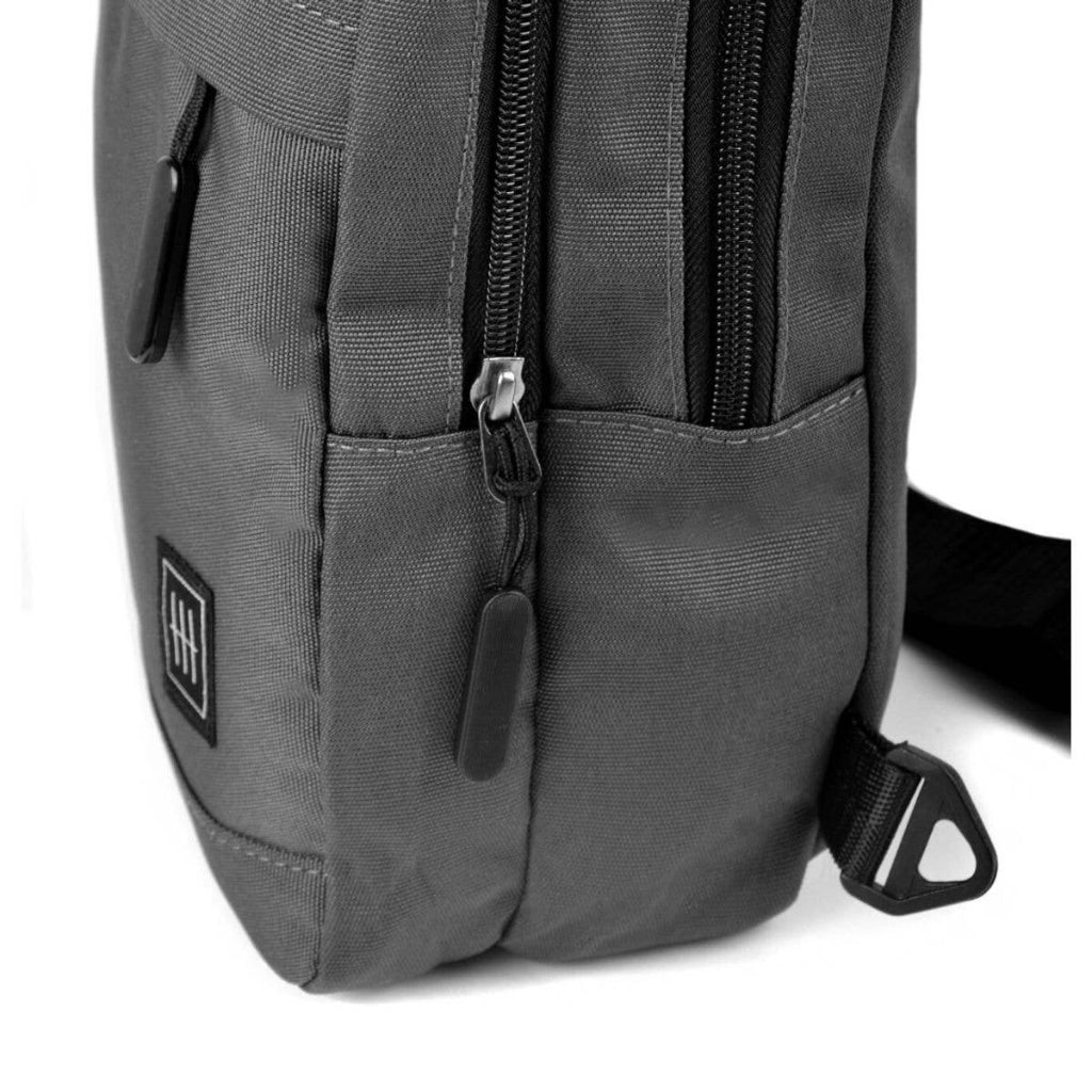 Gray backpack with a visible brand logo on a white background