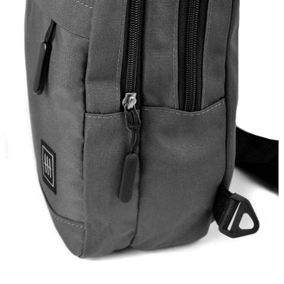 Gray backpack with a visible brand logo on a white background