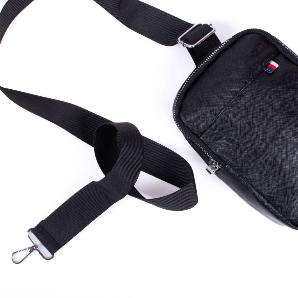Black shoulder bag with a strap on a white background