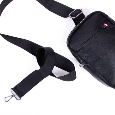 Black shoulder bag with a strap on a white background
