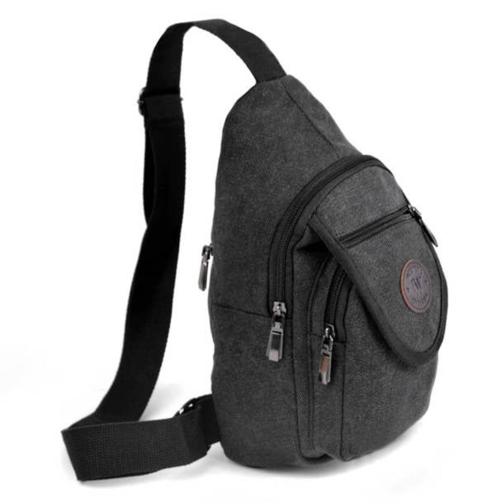Gray sling bag with multiple zippers on a white background