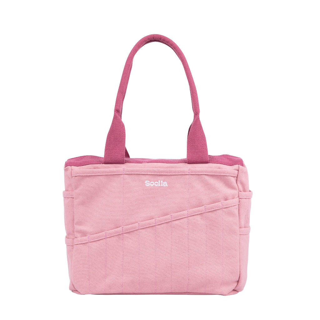 Pink tote bag with 'Soelle' branding on a white background