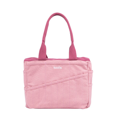 Pink tote bag with 'Soelle' branding on a white background
