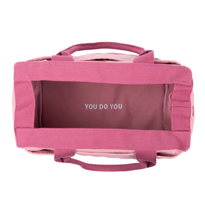 Pink bag with 'YOU DO YOU' text on a white background