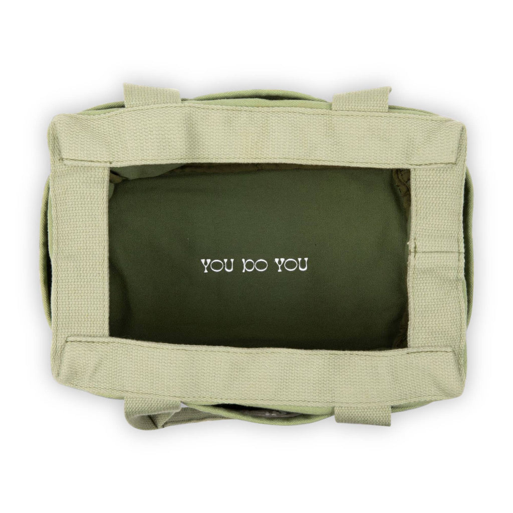 Green pouch with 'YOU DO YOU' text on a white background