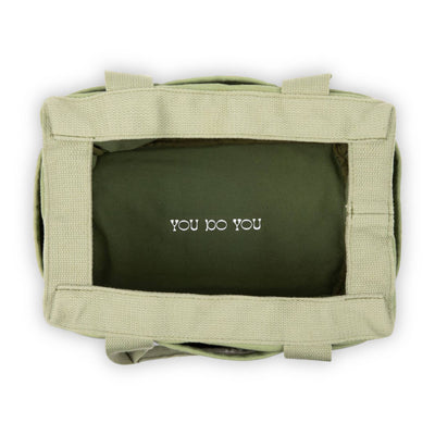 Green pouch with 'YOU DO YOU' text on a white background
