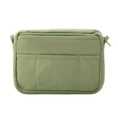 Green pouch with zippers on a white background