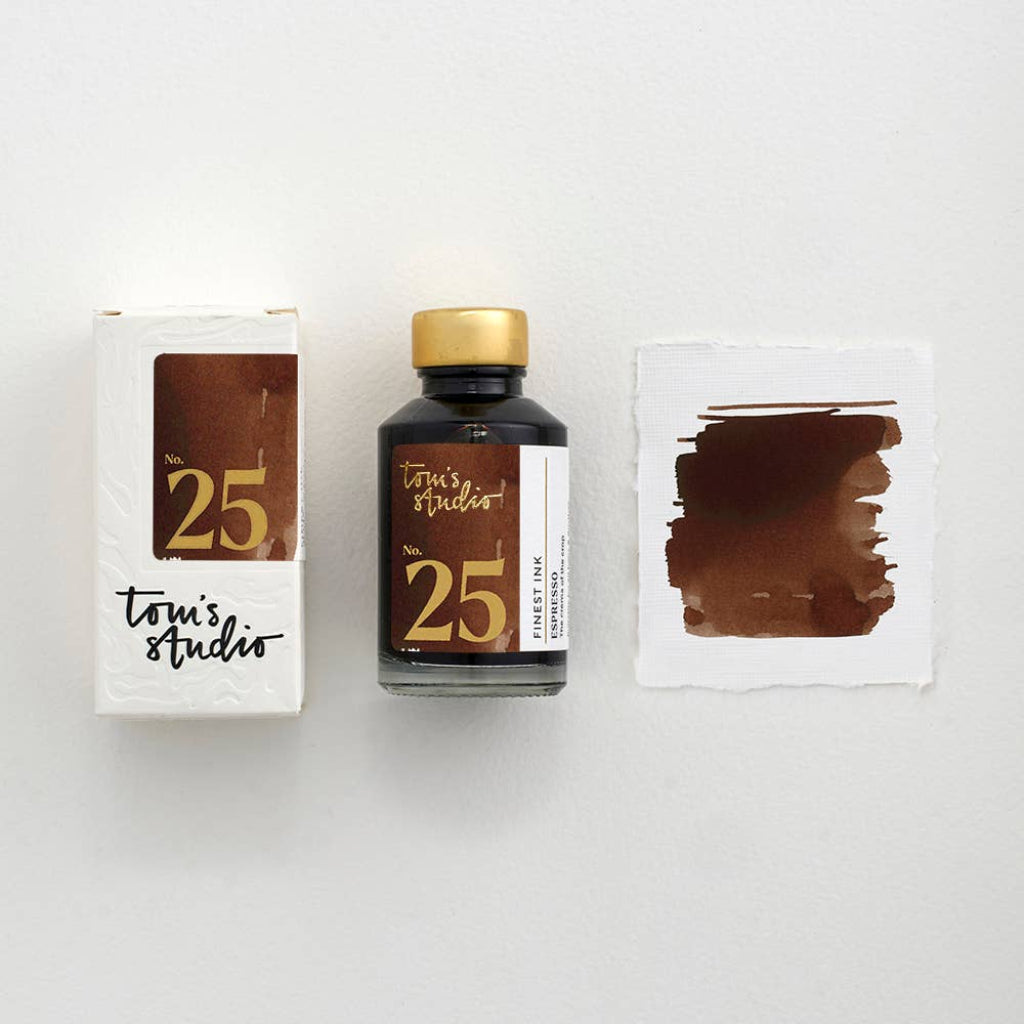 Tonic Studio ink bottle with packaging and color swatch on a white background