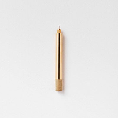 Tom's Studio Brass Lumos Pen on a light gray background, available at Lighthouse Paper Co. in Melbourne, FL