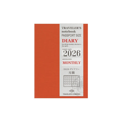 Red diary with white label displaying '2026' on a white background