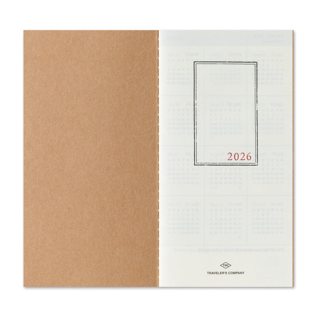 Two-tone notebook with brown and white cover, featuring '2026' and 'Traveler's Company' logo.