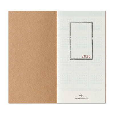 Two-tone notebook with brown and white cover, featuring '2026' and 'Traveler's Company' logo.