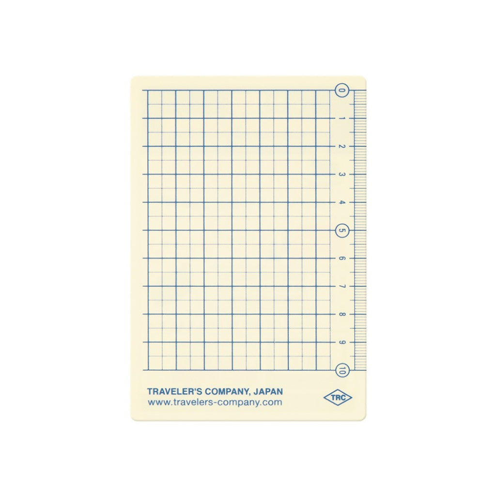 Grid notebook page with ruler from Traveler's Company on a white background