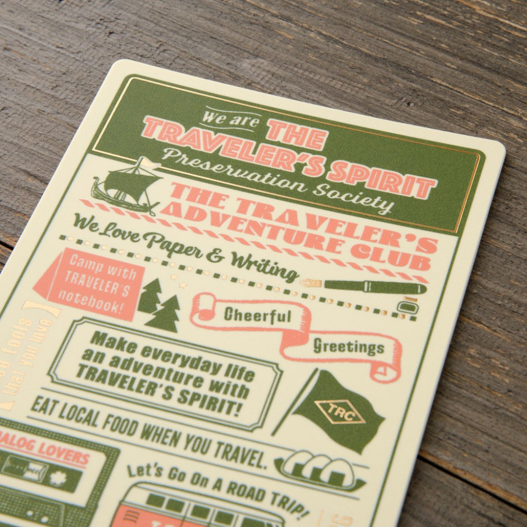 Vintage-style card with text and graphics on a wooden surface