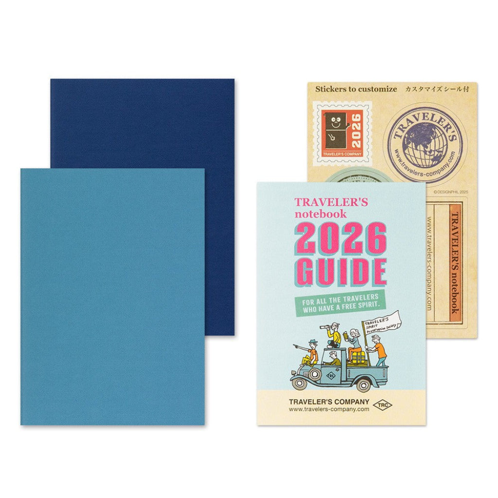 Traveler's notebook 2026 Guide with blue cover and additional items on a white background