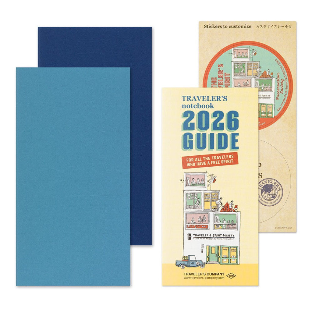 Traveler's notebook 2026 Guide with blue cover and sticker sheet on a white background