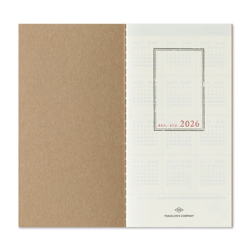 2026 planner with beige cover and white back featuring a grid layout and brand logo.