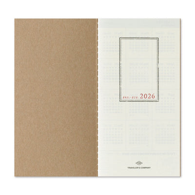 2026 planner with beige cover and white back featuring a grid layout and brand logo.