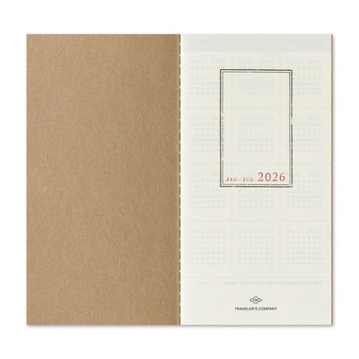 2026 planner with brown textured cover and white back featuring grid layout and 'Traveler's Company' logo.