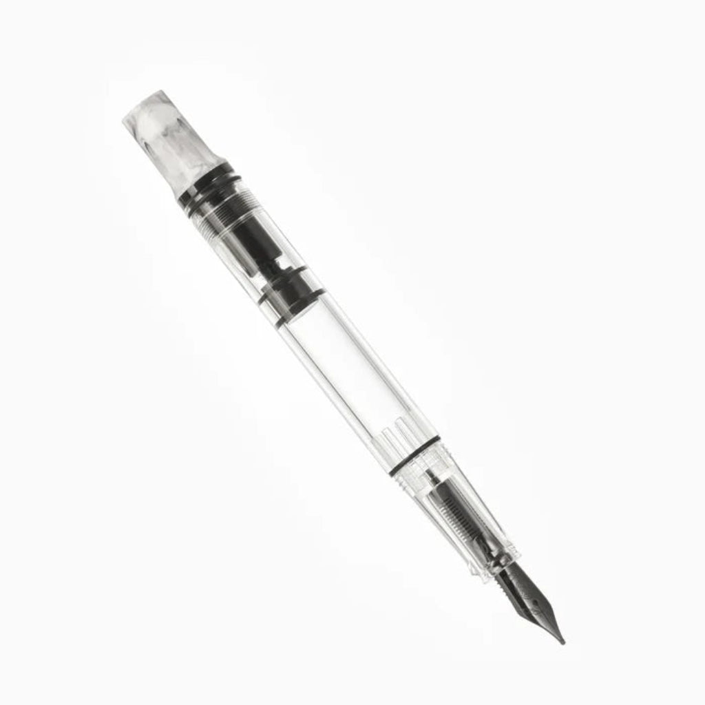 Clear pen with black ink cartridge on a white background