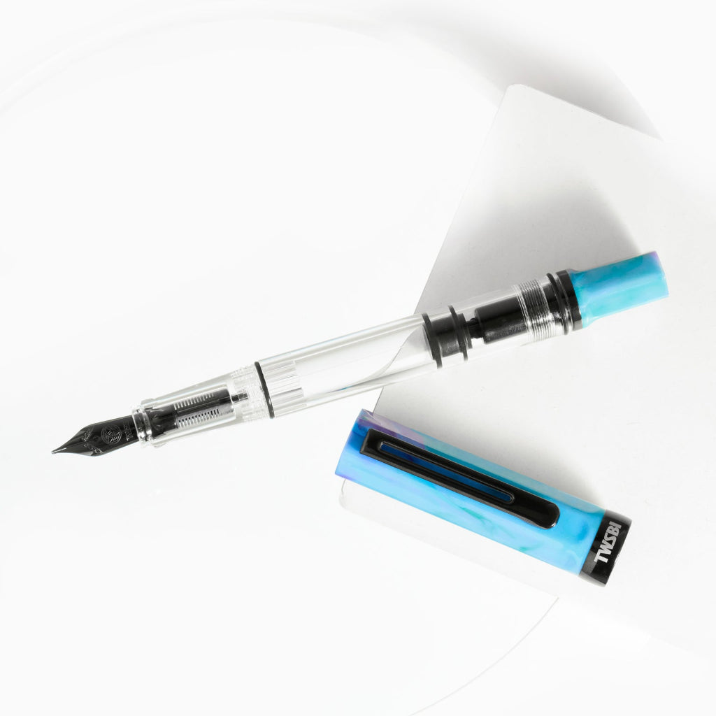 Fountain pen with a blue clip on a white background
