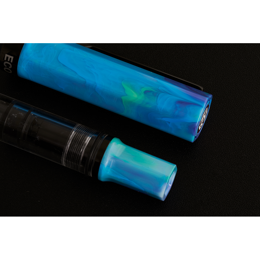 Two blue and black pens on a black background