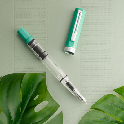 TWSBI Fountain Pen and Cap with Green Background