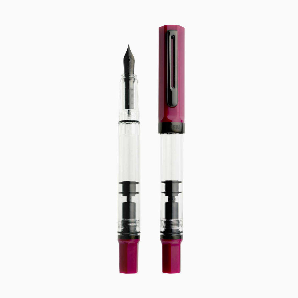 Fountain pen with a clear cartridge and red accents on a white background
