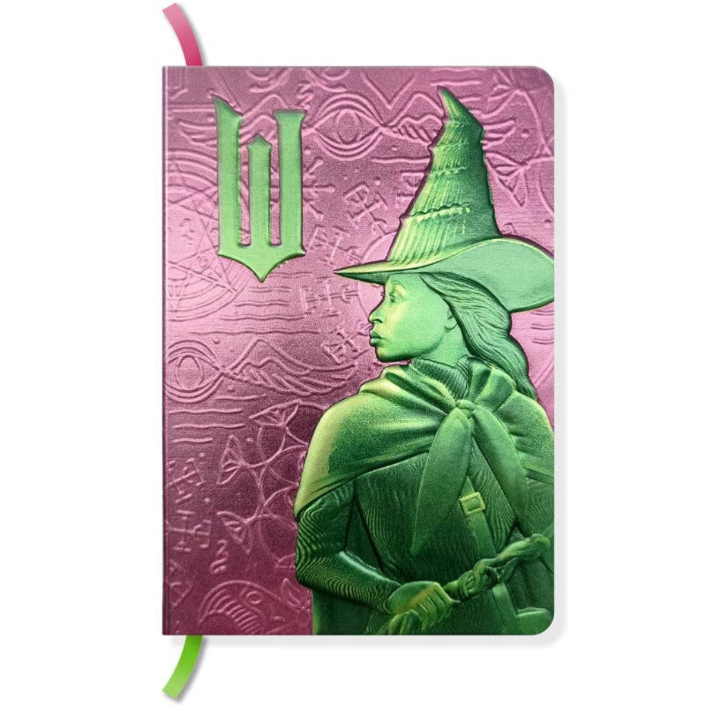Notebook with green witch design on a pink cover